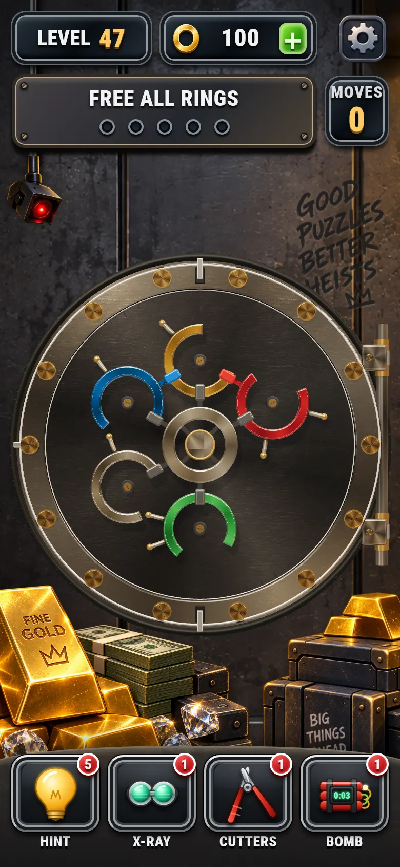 Level 47 in Ring Bandit: five coloured rings with clips and pins on the vault door, and the Hint, X-Ray, Cutters and Bomb power-ups below